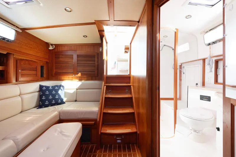 Slide: The Image of 2008 Sabre 34 Express yacht interior with wooden finish and cozy seating area. - 12