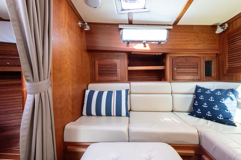 Slide: The Image of Interior of 2008 Sabre 34 Express yacht with cozy seating and nautical decor. - 14