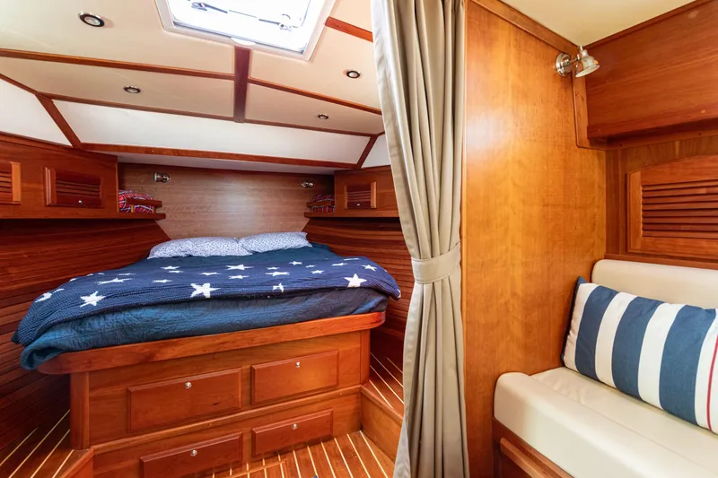 Slide: The Image of Luxurious 2008 Sabre 34 Express cabin with cozy bed and elegant wood finish. - 16