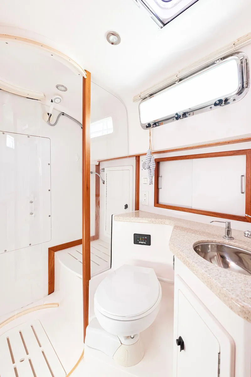 Slide: The Image of 2008 Sabre 34 Express yacht bathroom with shower, sink, and toilet. - 18