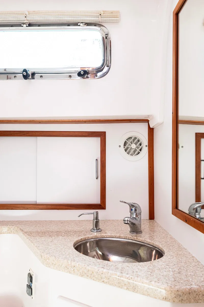 Slide: The Image of 2008 Sabre 34 Express yacht bathroom with sink and mirror. - 19