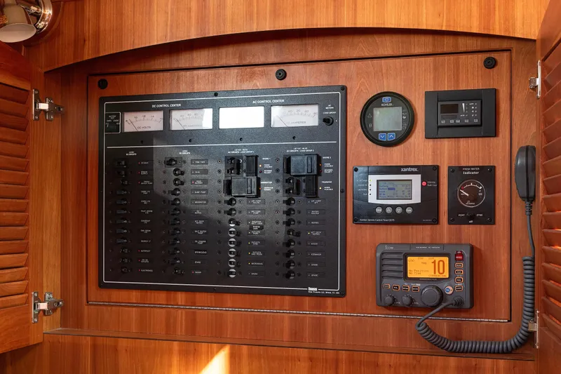 Slide: The Image of Electrical control panel on 2008 Sabre 34 Express boat, featuring various gauges and switches. - 20