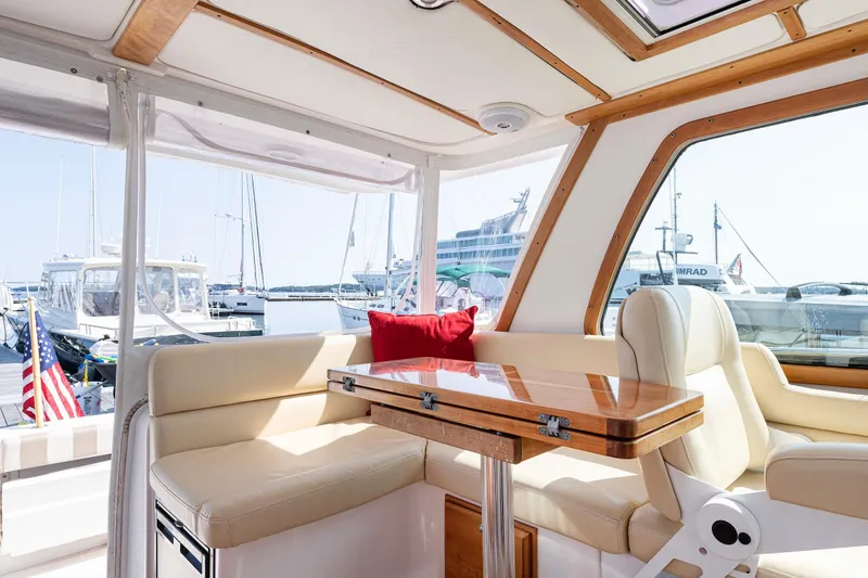 Slide: The Image of Interior of 2008 Sabre 34 Express yacht with elegant seating and table. - 9