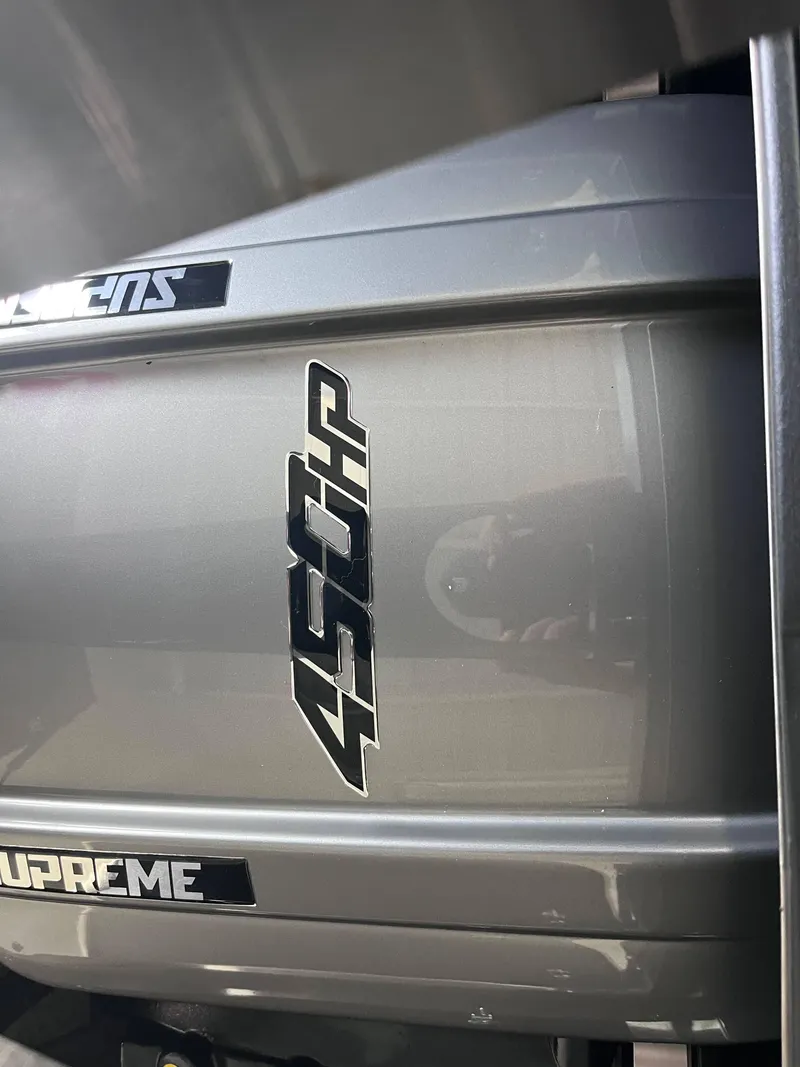 Slide: The Image of 2025 Supreme S240 engine with 450 horsepower badge, close-up view. - 10