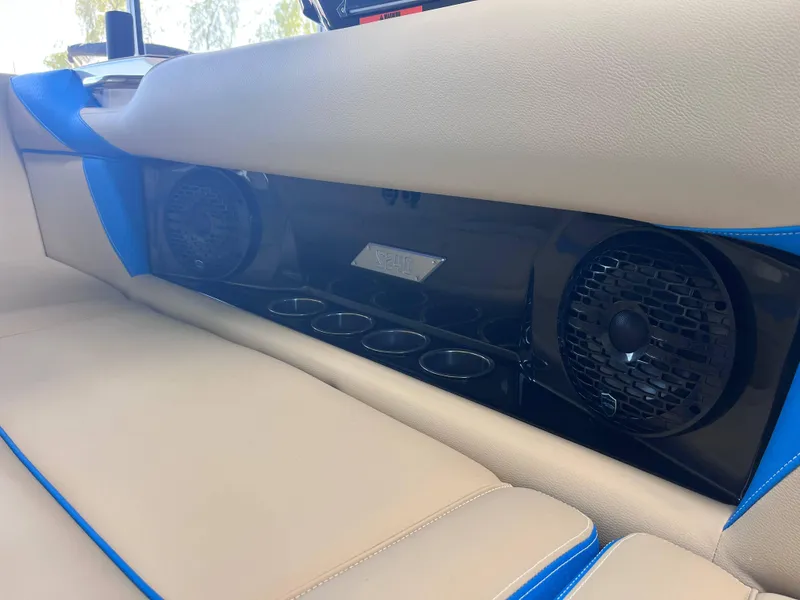 Slide: The Image of 2025 Supreme S240 interior with speakers and cup holders, featuring beige and blue upholstery. - 5