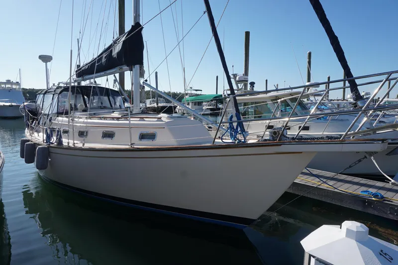 The Image of 1994 Island Packet 32 sailboat docked at marina, side view. - 0