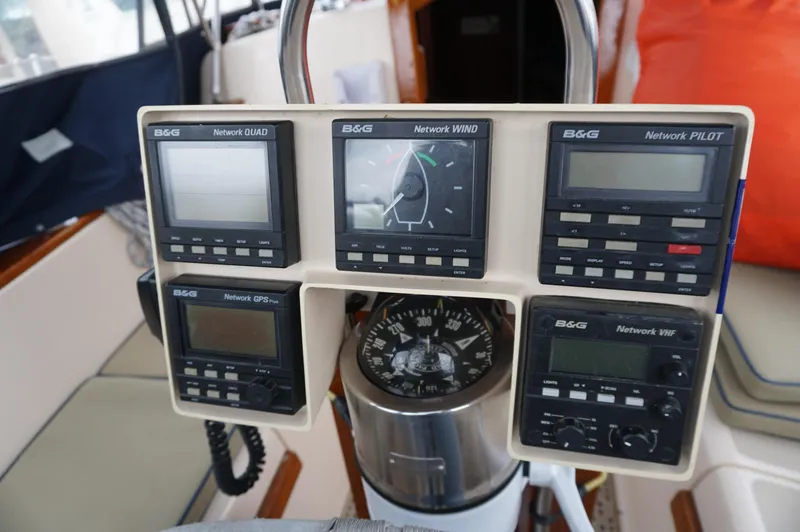 Slide: The Image of Cockpit instruments on a 1994 Island Packet 32 sailboat, featuring B&G navigation displays. - 40