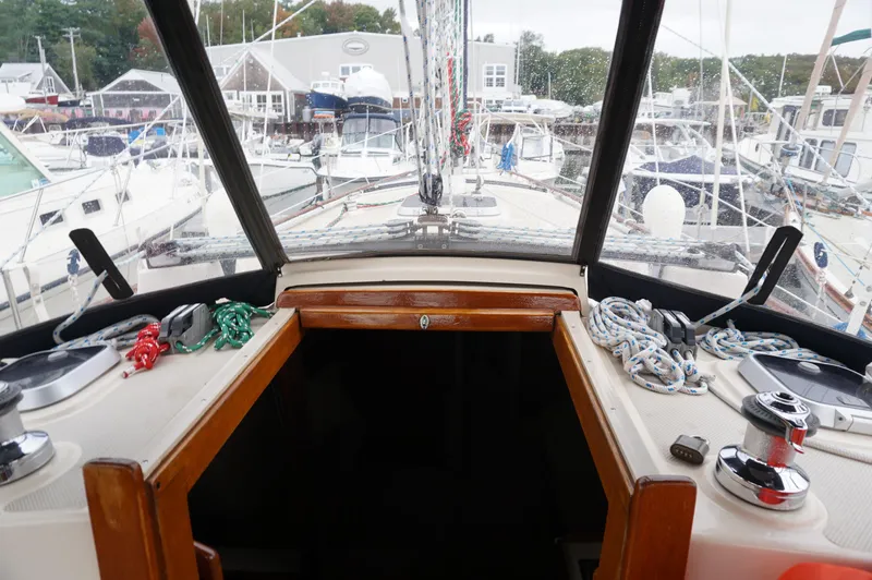 Slide: The Image of Cockpit view of 1994 Island Packet 32 sailboat docked at marina. - 42