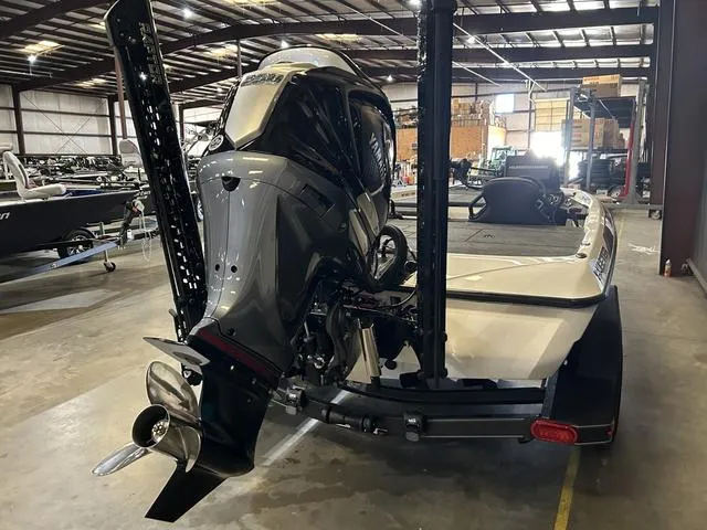 Slide: The Image of 2025 Skeeter ZXR20 with Yamaha 250 outboard in a warehouse setting. - 5