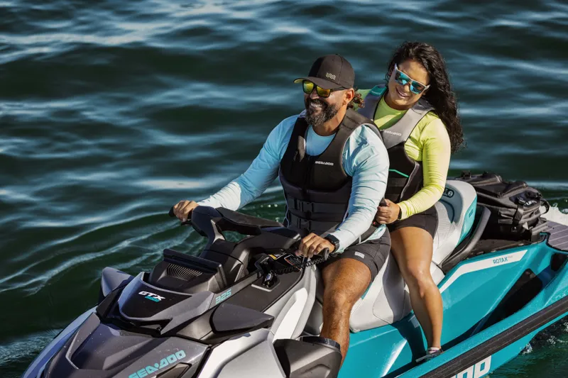Slide: The Image of Couple enjoying a ride on a 2025 Sea-Doo GTX Limited 325 on the water. - 11