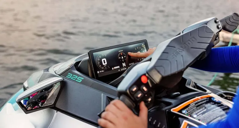 Slide: The Image of 2025 Sea-Doo GTX Limited 325 dashboard with sound system on water. - 3