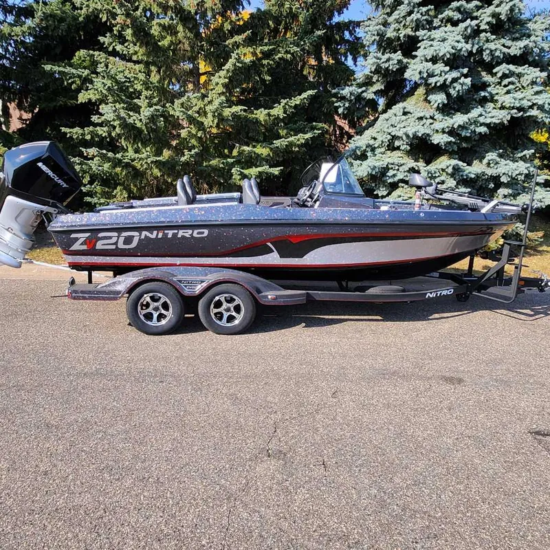 The Image of 2024 Nitro ZV20 Pro fishing boat on trailer, parked outdoors. - 0