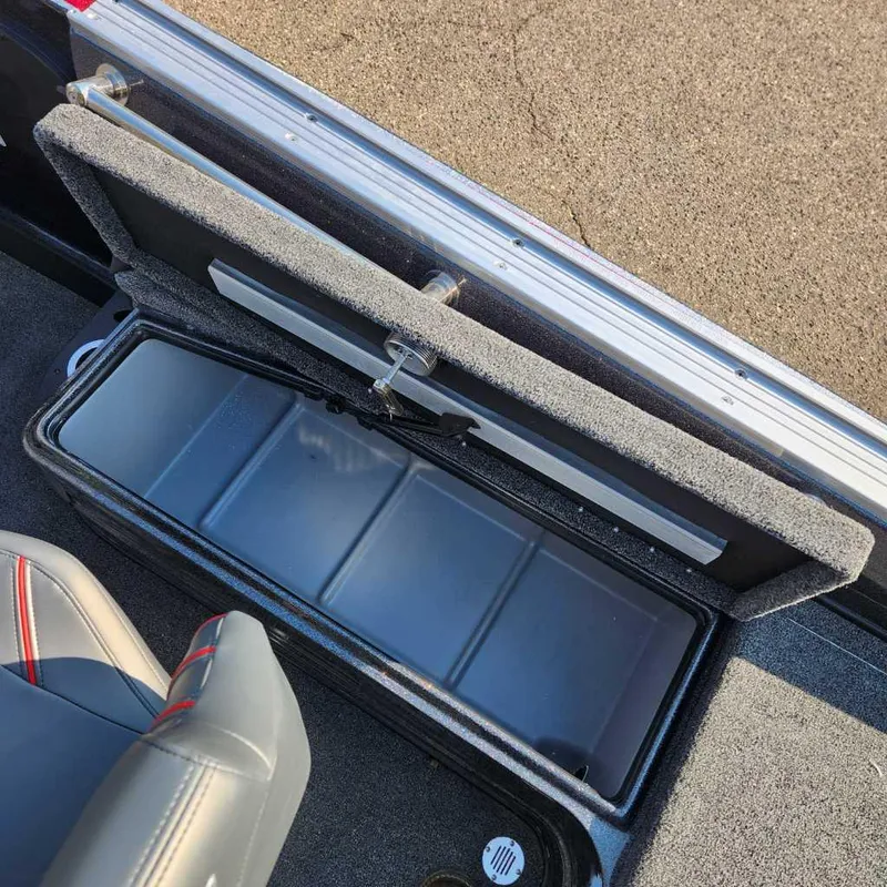 Slide: The Image of 2024 Nitro ZV20 Pro boat storage compartment with open lid and seating. - 10