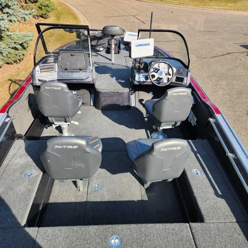 Slide: The Image of 2024 Nitro ZV20 Pro fishing boat interior with four seats and steering console. - 3