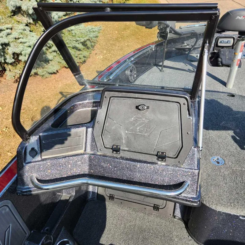 Slide: The Image of 2024 Nitro ZV20 Pro boat interior with storage compartment and windshield. - 4