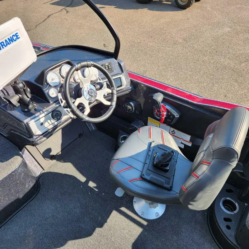 Slide: The Image of 2024 Nitro ZV20 Pro boat cockpit with steering wheel and seat. - 5