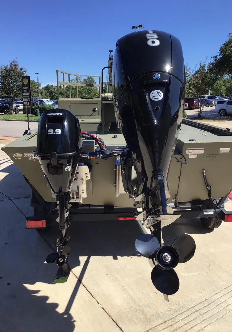 Slide: The Image of 2025 Tracker Grizzly 2072 CC Sportsman Kicker boat with dual outboard motors. - 4