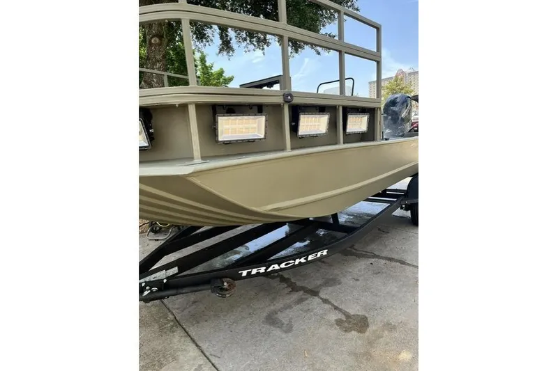 Slide: The Image of 2025 Tracker Grizzly 2072 CC Sportsman Kicker boat on trailer, featuring front lights. - 5
