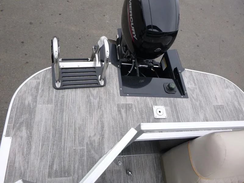 Slide: The Image of 2024 Ranger Reata 223C boat deck with Mercury engine and swim ladder. - 15