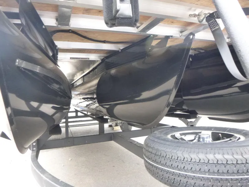 Slide: The Image of 2024 Ranger Reata 223C pontoon boat underside with trailer and tire. - 18