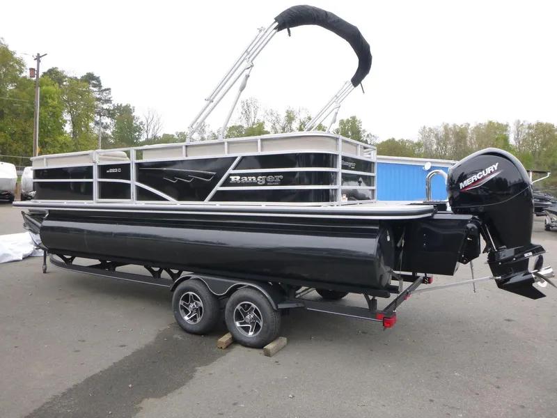 Slide: The Image of 2024 Ranger Reata 223C pontoon boat with Mercury outboard on trailer. - 5