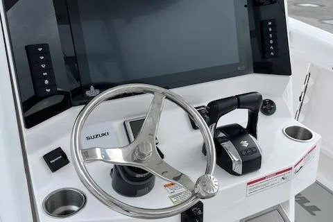 Slide: The Image of Steering console of 2025 Twin Vee 280 GFX2 CC boat with Suzuki controls. - 23