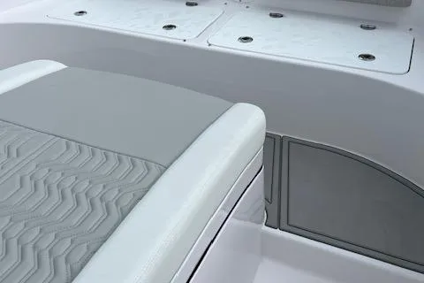 Slide: The Image of 2025 Twin Vee 280 GFX2 CC boat interior with sleek seating and storage compartments. - 26