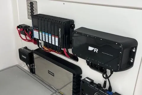 Slide: The Image of 2025 Twin Vee 280 GFX2 CC electrical panel with advanced marine electronics. - 27