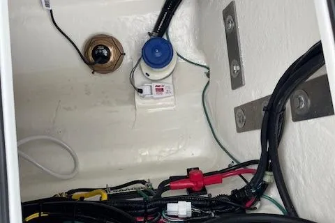 Slide: The Image of 2025 Twin Vee 280 GFX2 CC boat wiring and components in storage compartment. - 30