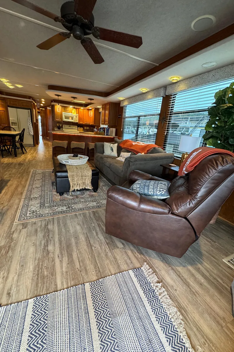 Slide: The Image of Interior of a 1999 Sumerset 16 X 80 houseboat with cozy living area and modern furnishings. - 19