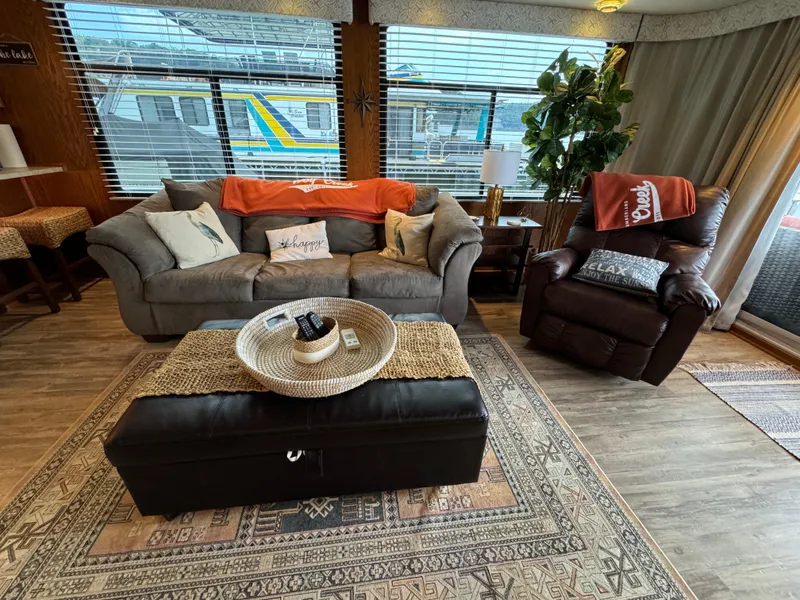 Slide: The Image of Cozy living area in a 1999 Sumerset 16 X 80 houseboat with modern decor. - 20