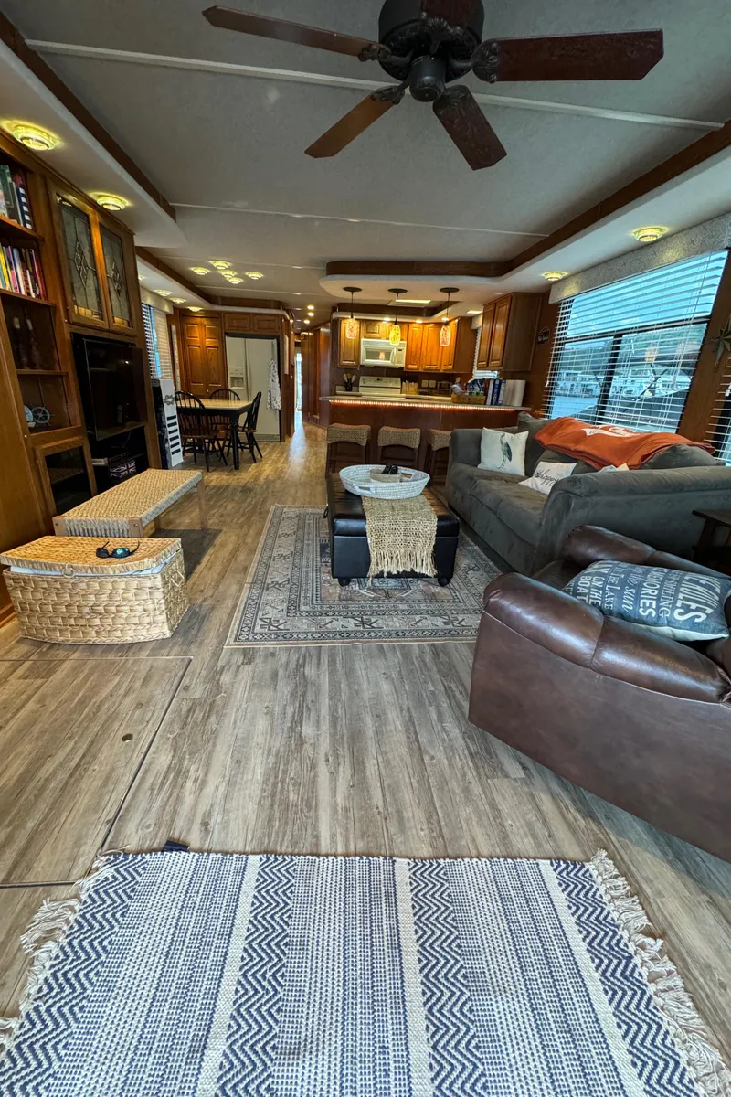 Slide: The Image of Spacious 1999 Sumerset 16 X 80 houseboat interior with cozy living area and modern kitchen. - 24