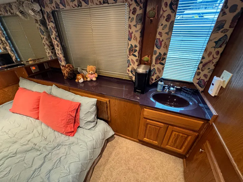 Slide: The Image of Cozy bedroom in 1999 Sumerset 16 X 80 houseboat with sink, bed, and decorative accents. - 30