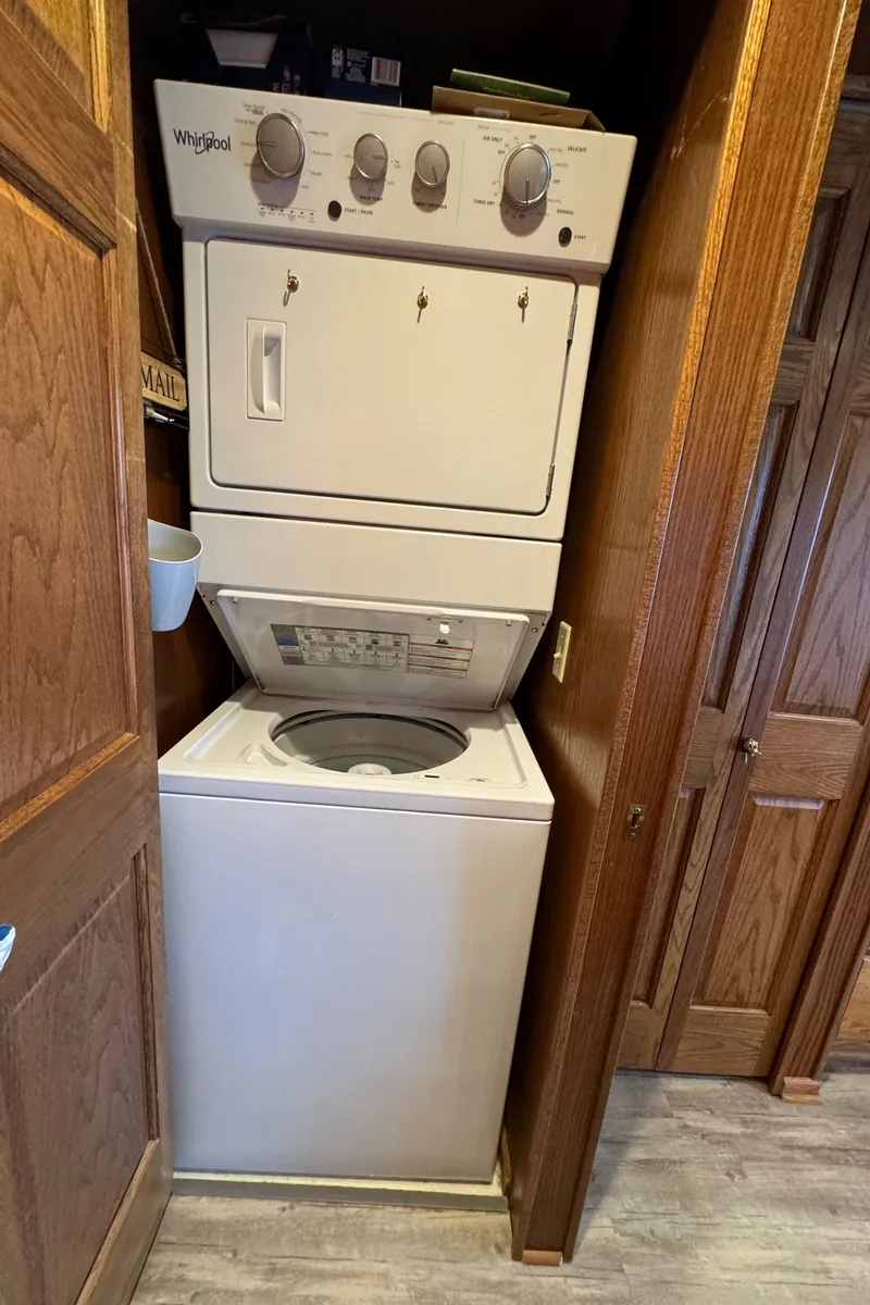 Slide: The Image of Stacked washer and dryer in a 1999 Sumerset 16 X 80 houseboat. - 37