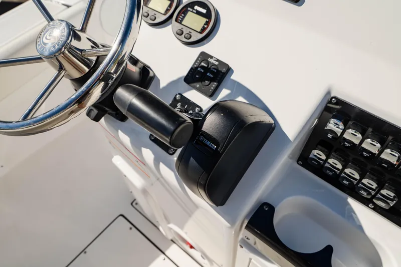 Slide: The Image of Edgewater 188CC 2025 boat dashboard with steering wheel and controls. - 13