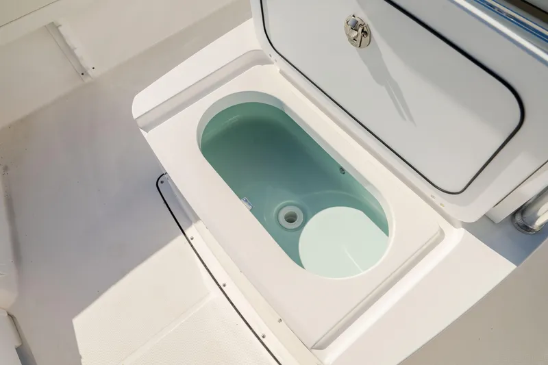 Slide: The Image of Edgewater 188CC 2025 boat livewell with open lid, showcasing interior design. - 27