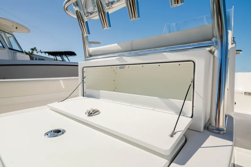 Slide: The Image of Edgewater 188CC 2025 boat console with storage compartment and rod holders. - 28