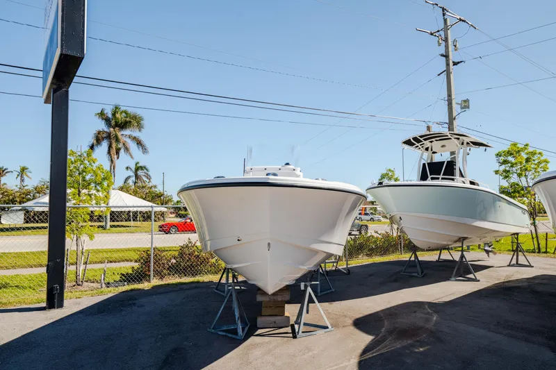 Slide: The Image of 2025 Edgewater 188CC boat displayed outdoors on stands. - 30