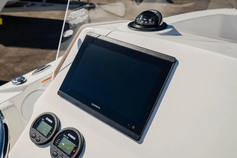 Slide: The Image of 2025 Edgewater 188CC boat dashboard with Garmin display and Yamaha gauges. - 6