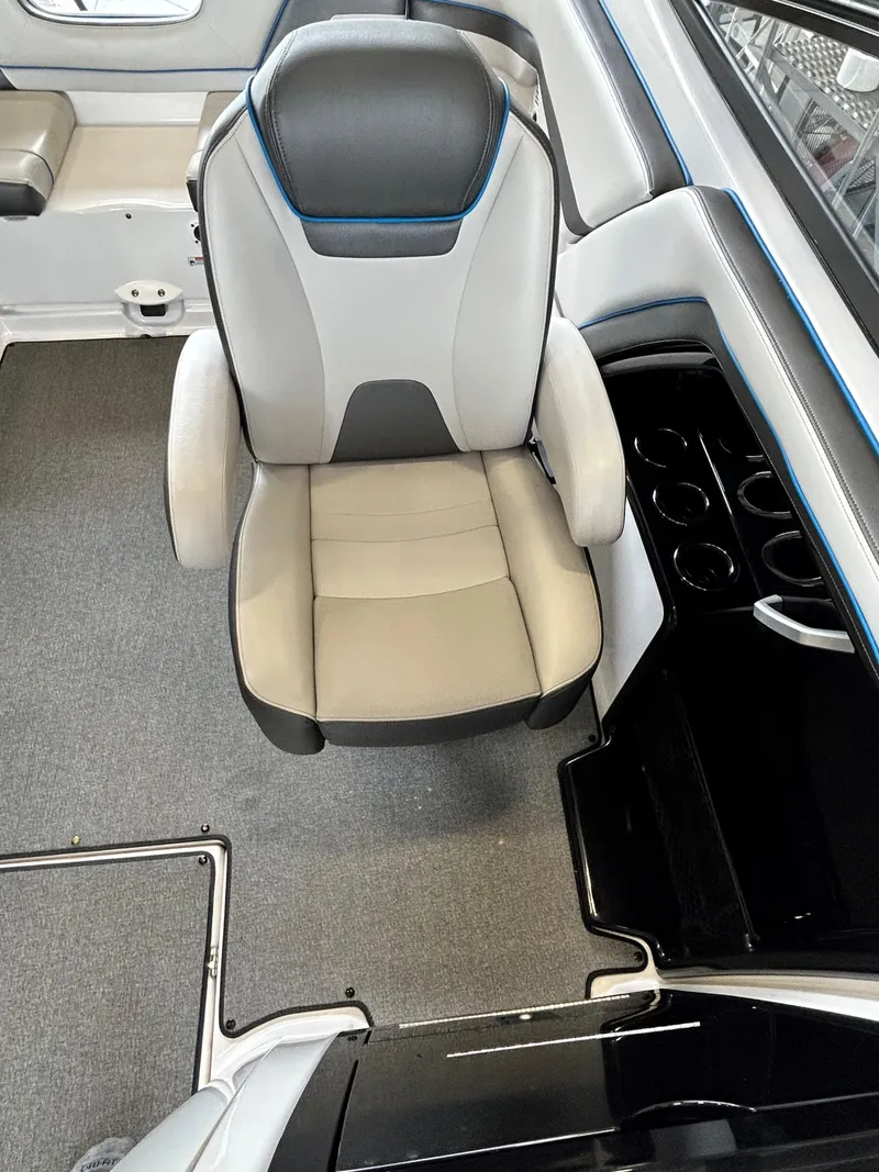 Slide: The Image of 2020 Yamaha AR 240 boat interior with captain's chair and cup holders. - 10