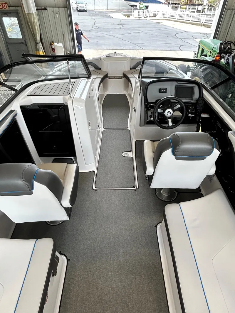 Slide: The Image of 2020 Yamaha AR 240 boat interior with modern seating and dashboard. - 13