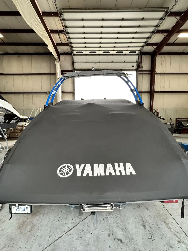 Slide: The Image of 2020 Yamaha AR 240 boat with cover in a storage facility. - 17