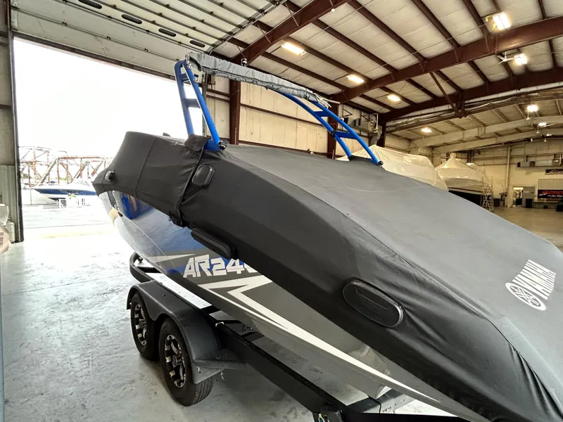 Slide: The Image of 2020 Yamaha AR 240 boat with cover in a storage facility. - 5