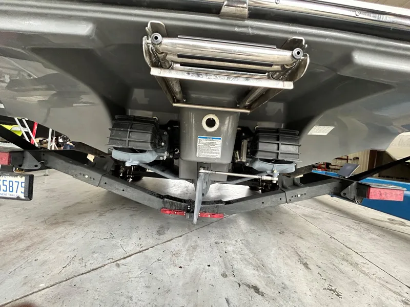 Slide: The Image of 2020 Yamaha AR 240 boat underside with trailer, showcasing dual engines and ladder. - 8