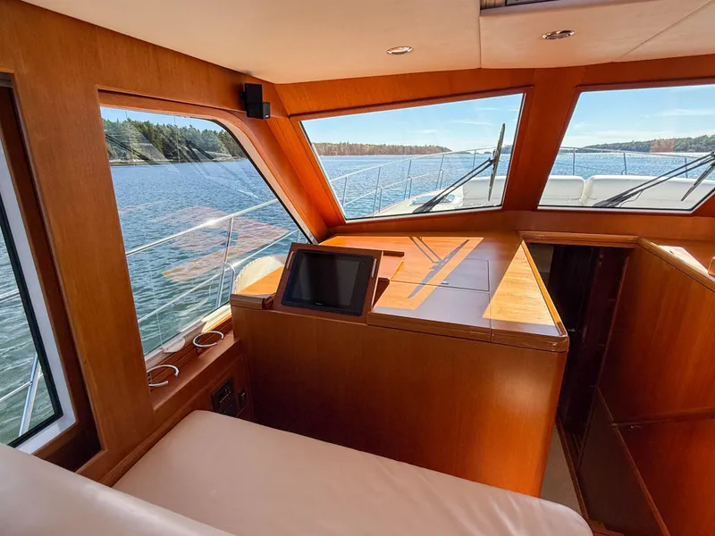 Slide: The Image of Interior view of 2014 Grand Banks 50 Eastbay SX yacht with scenic water backdrop. - 16