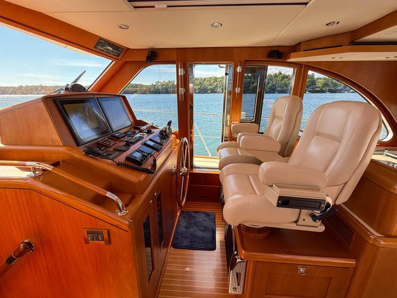 Slide: The Image of Luxurious 2014 Grand Banks 50 Eastbay SX yacht interior with helm and leather seats. - 18