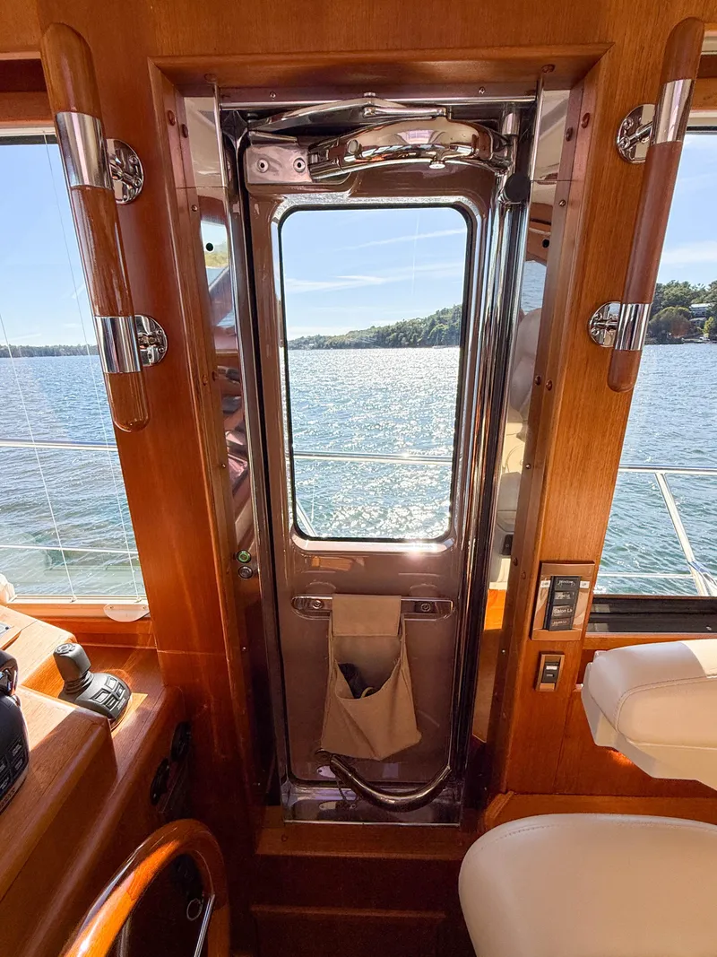 Slide: The Image of Interior view of 2014 Grand Banks 50 Eastbay SX yacht with ocean backdrop. - 22