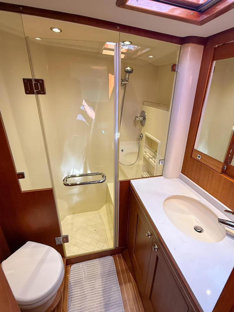 Slide: The Image of Luxurious bathroom in 2014 Grand Banks 50 Eastbay SX yacht with shower and vanity. - 24