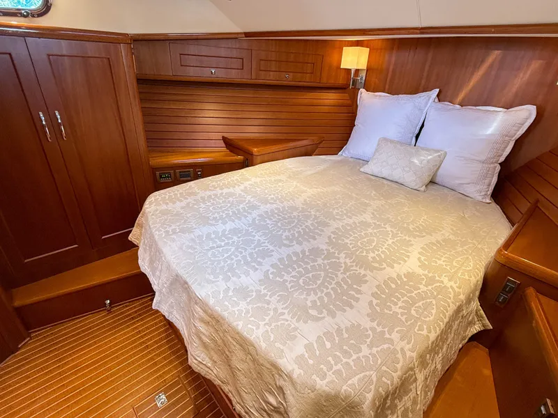 Slide: The Image of Luxurious cabin interior of 2014 Grand Banks 50 Eastbay SX yacht with elegant wood finish. - 28