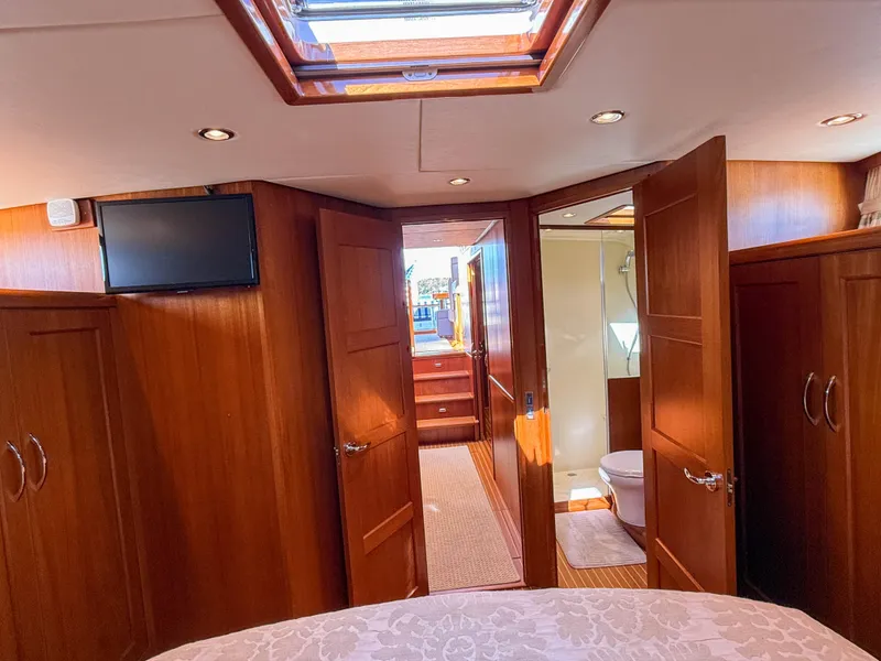 Slide: The Image of Luxurious 2014 Grand Banks 50 Eastbay SX yacht interior with wood paneling and skylight. - 30